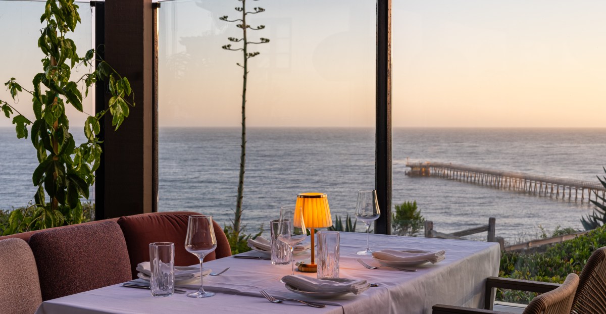Ocean-view dining table at Marisella at sunset