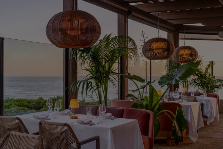 Marisella's oceanview dining room at dusk
